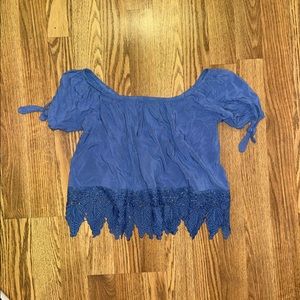 Blue off the shoulder top with lace details on the bottom and ties on arms